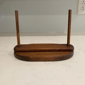 May include: A set of three ceramic mugs with a speckled, matte finish. The mugs are in shades of cream, light gray, and dark gray. Each mug has a simple, minimalist design, perfect for coffee or tea.