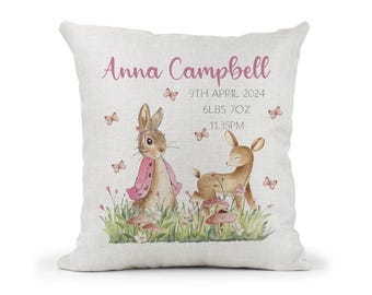 May include: A white cushion featuring a pink bunny and a fawn in a woodland scene. The cushion is personalised with the name "Anna Campbell", the date "9th April 2024", the weight "6lbs 7oz", and the time "11:35PM".