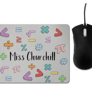 May include: A grey mouse mat with a colourful pattern of maths symbols and the text "Miss Churchill".