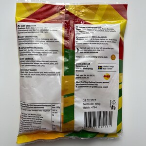 May include: A yellow and red bag of sour jelly candies with the brand name "Bubs" and the text "Sour Jelly Candy" printed on the back. The bag contains 190g of candy and has a best before date of 28.02.2027.