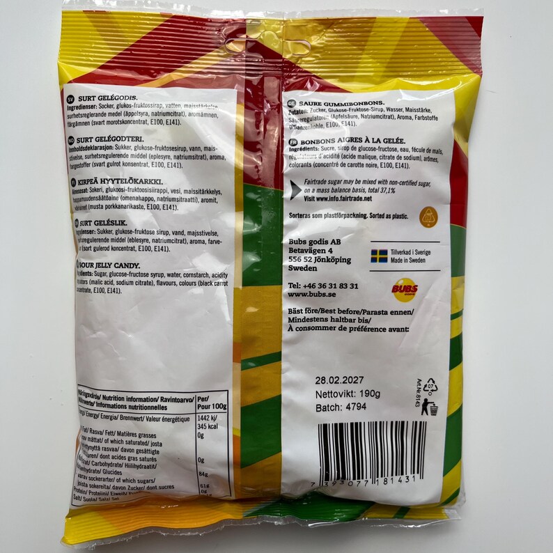 May include: A yellow and red bag of sour jelly candies with the brand name "Bubs" and the text "Sour Jelly Candy" printed on the back. The bag contains 190g of candy and has a best before date of 28.02.2027.