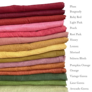 May include: A stack of folded fabric in various colors, including plum, burgundy, ruby red, light pink, peach, rust pink, honey, lemon, mustard, salmon blush, pumpkin orange, orange, vintage green, lime green, and avocado green. The names of the colors are listed on the right.