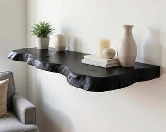 Zwarte drijvende houten plank aan de muur gemonteerde op maat gemaakte planken houtsnijwerk handgemaakte boekenplankdecoratie