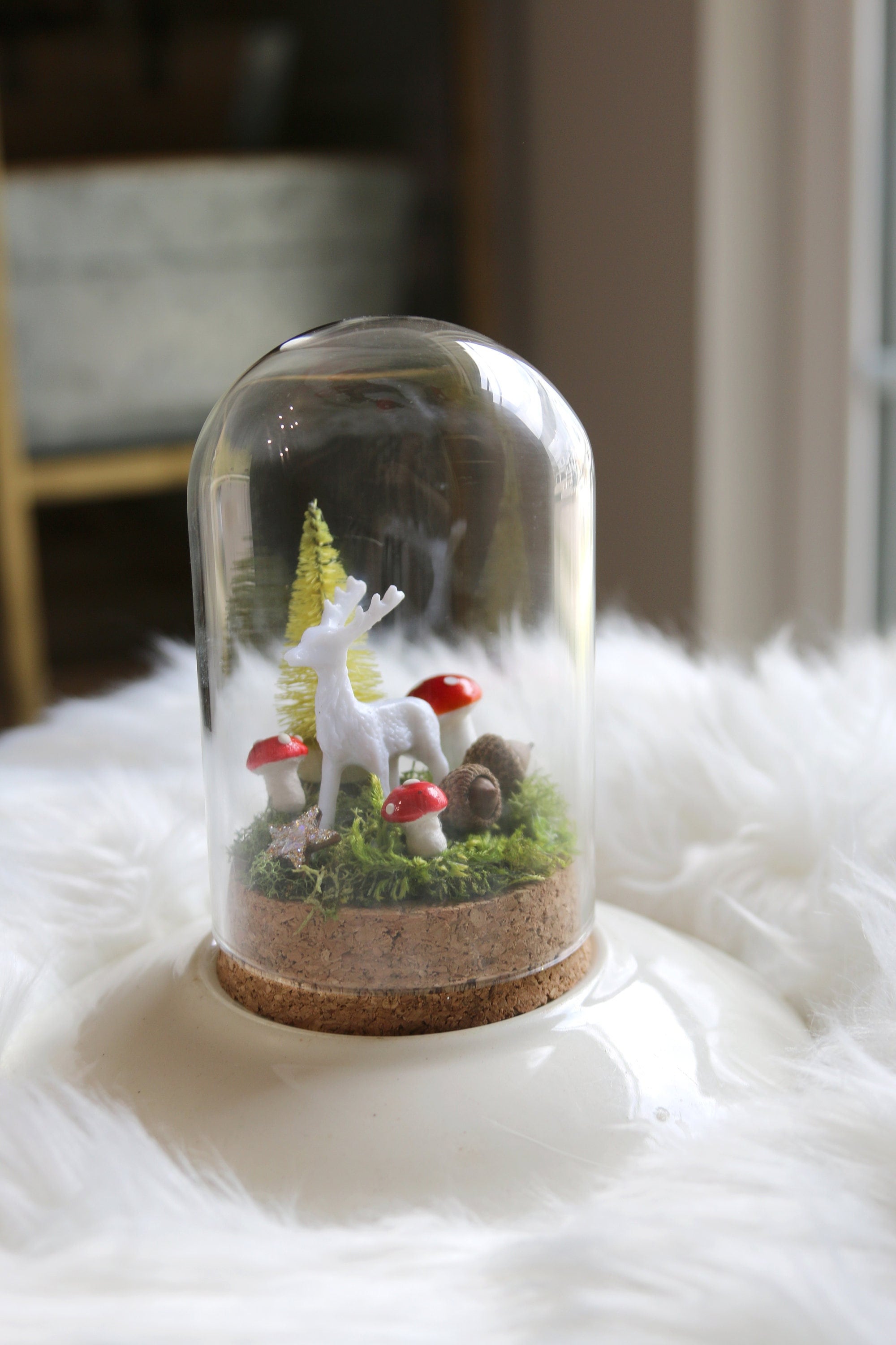 4.5" glass Cloche miniature scene bottle brush tree, white deer, real acorn, tiny mushrooms, glittered star all on a moss bed