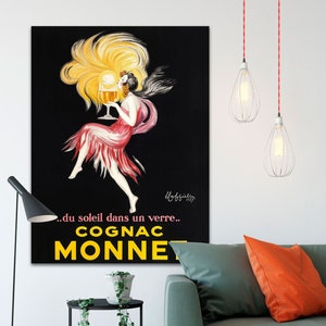 A vintage poster advertising Cognac Monnet from Transit Design. The canvas poster reads '...du soleil dans un verre... COGNAC MONNET.'