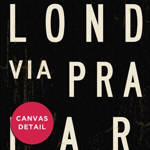 May include: Black and white typography art print with the words "LONDON VIA PRAIAR" in a bold, sans-serif font. The word "PRAIAR" is partially obscured by a red circle with the text "CANVAS DETAIL" in white.