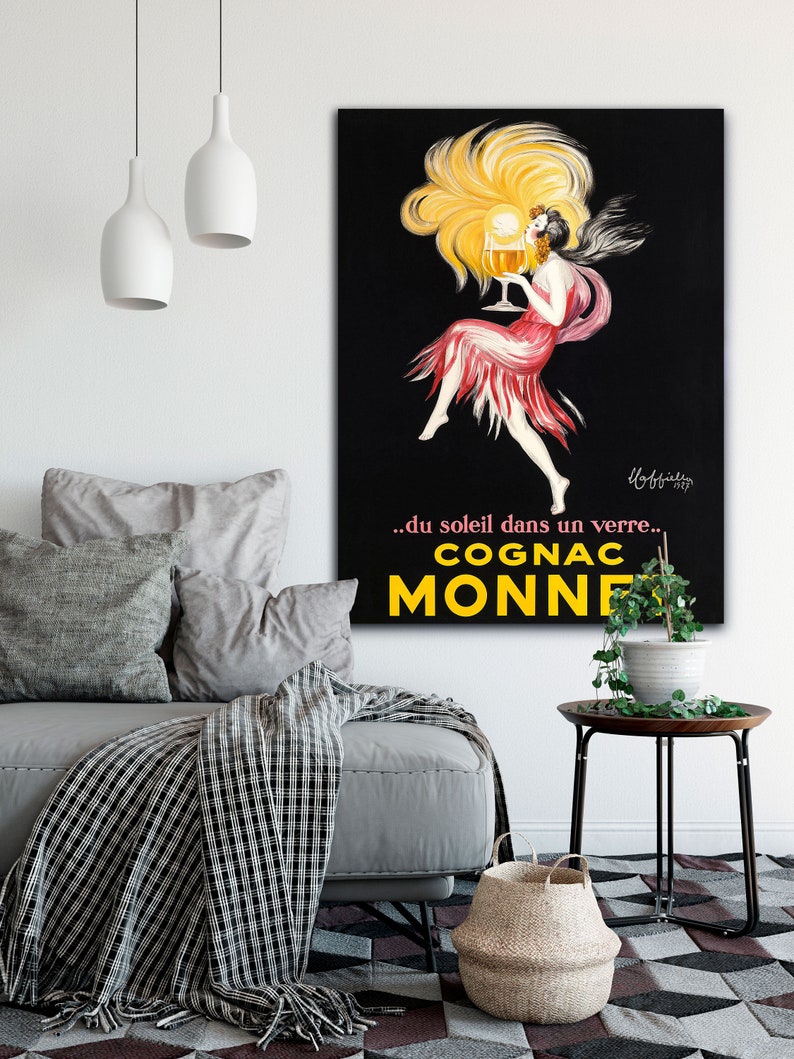 A vintage poster advertising Cognac Monnet from Transit Design. The poster says '...du soleil dans un verre... Cognac Monnet.'