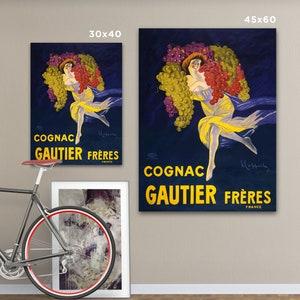 Puede incluir: P&oacute;ster vintage que anuncia el Cognac Gautier Fr&egrave;res, con una mujer rodeada de uvas sobre un fondo azul oscuro. El texto dice "Cognac Gautier Fr&egrave;res Francia".
