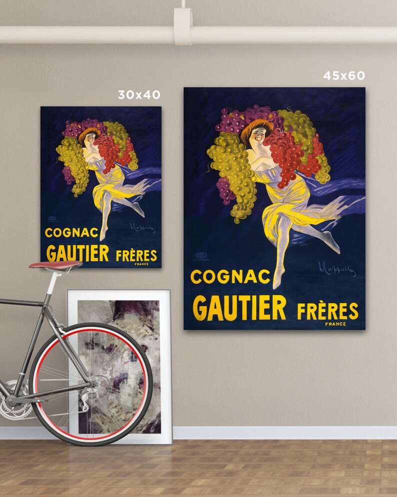 Puede incluir: P&oacute;ster vintage que anuncia el Cognac Gautier Fr&egrave;res, con una mujer rodeada de uvas sobre un fondo azul oscuro. El texto dice "Cognac Gautier Fr&egrave;res Francia".