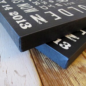 May include: Two black canvas prints with white text. The top print says "Older is not a time to be less, but a time to be more." The bottom print says "Older is not a time to be less, but a time to be more."