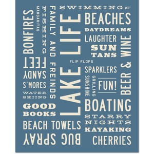May include: A blue and white typography print with the words "Lake Life" in large letters. The print features a list of words related to summer activities, such as "swimming", "beaches", "bonfires", "fishing", "boating", and "kayaking".