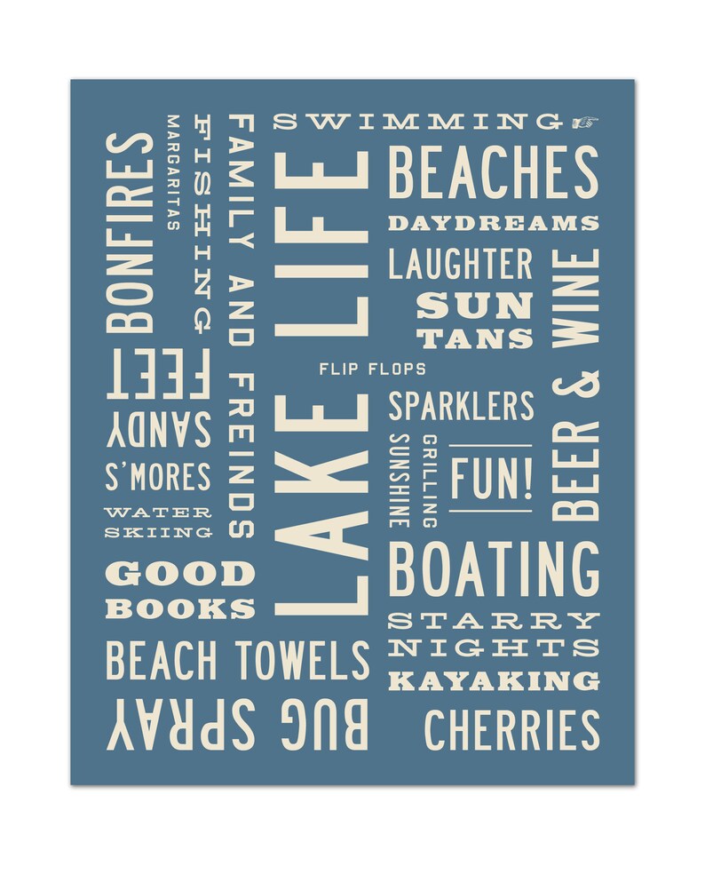 May include: A blue and white typography print with the words "Lake Life" in large letters. The print features a list of words related to summer activities, such as "swimming", "beaches", "bonfires", "fishing", "boating", and "kayaking".