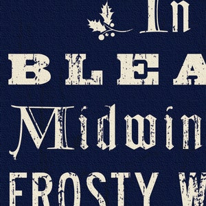 May include: A navy blue background with the words "In Bleak Midwinter Frosty Wind" in a distressed, off-white font. A holly sprig with berries is above the text. The image has a textured appearance.