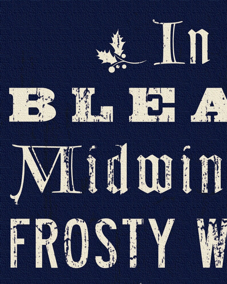 May include: A navy blue background with the words "In Bleak Midwinter Frosty Wind" in a distressed, off-white font. A holly sprig with berries is above the text. The image has a textured appearance.