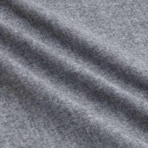 May include: Close-up of a textured, gray fabric with subtle diagonal folds. The material appears soft and has a slightly mottled appearance, suggesting a woven or knitted construction. The overall tone is neutral, with variations in light and shadow.