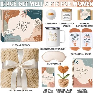 May include: An 11-piece gift set including a patterned box, a bath bomb, a 3.5oz scented candle, oatmeal soap, a 12oz insulated tumbler with 'Hug in a Mug' text, cotton socks, a silk eye mask, a blanket, a card, a crochet heart plant, and a notebook.