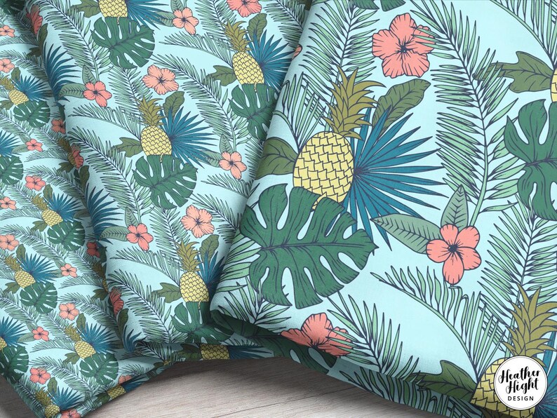 Three different fabric print scales featuring a pattern of tropical palm fronts, pineapples, and pink hibiscus flowers on a light blue background.