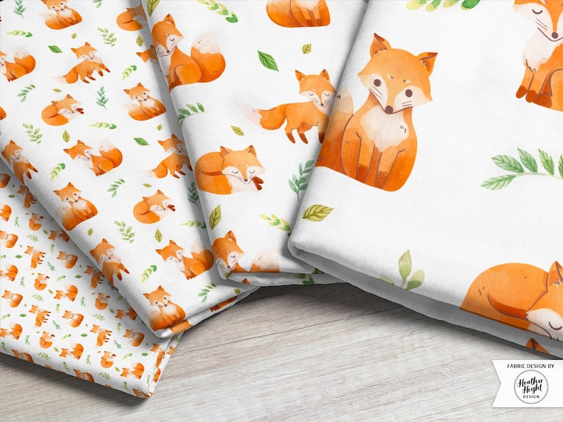 Four fabric print scales featuring white fabric with a pattern of bright orange watercolor foxes with scattered green foliage.