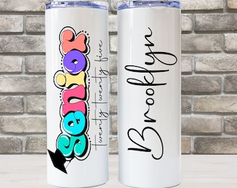 May include: Two white stainless steel tumblers. One tumbler has a colorful graphic that says "Senior twenty twenty five" and the other tumbler has the name "Brooklyn" written in black cursive.