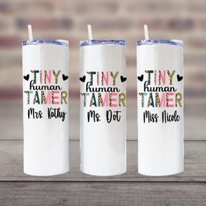 May include: Three white stainless steel tumblers with a leopard print design and the text "Tiny Human Tamer" in pink, green, and black. The tumblers are personalized with the names "Mrs. Kathy", "Ms. Dot", and "Miss Nicole".