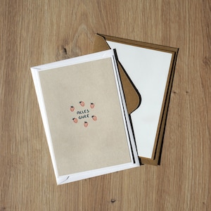 VŒUX À LA FRAISE - Carte de vœux risographiée faite à la main au format A6 avec un motif de fraise dessiné à la main, imprimé en rouge et bleu sarcelle