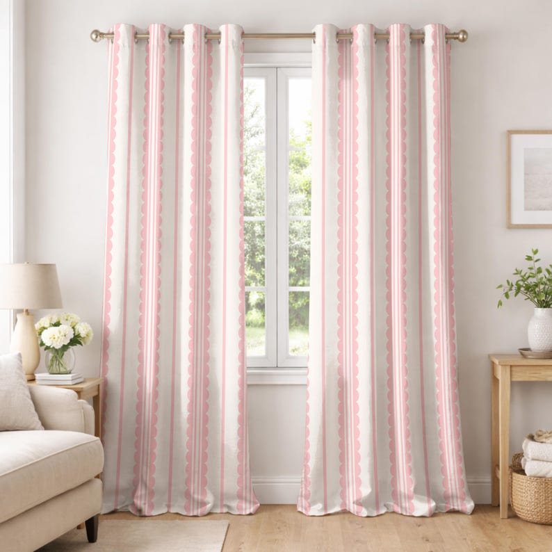 May include: Two matching window curtains with a striped pattern. The curtains are primarily off-white with vertical stripes of pink and a scalloped edge design. The curtains are hanging from a gold-colored rod.