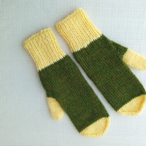 May include: A pair of knitted mittens with a yellow and green color scheme. The mittens are made of a soft, textured yarn and have a simple, classic design.
