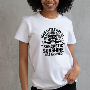 Sarcastic Funny,raccoon quote svg,sarcastic quote svg,Sarcastic Funny SVG,sassy raccoon svg,trendy raccoon svg,your little ray svg,sassy raccoon,sarcastic raccoon,raccoon sarcastic,sublimation raccoon,raccoon quote,sarcastic sunshineYour little ray of sarcastic sunshine svg, Sarcastic svg, Has arrived svg, funny raccoon svg, sassy raccoon , trendy design sublimation PNG
Your Little Ray Of Sarcastic Sunshine Has Arrived SVG PNG, Retro Funny Raccoon Shirt Design, Sarcastic Svg, Sassy Meme