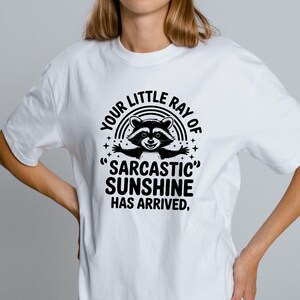 Sarcastic Funny,raccoon quote svg,sarcastic quote svg,Sarcastic Funny SVG,sassy raccoon svg,trendy raccoon svg,your little ray svg,sassy raccoon,sarcastic raccoon,raccoon sarcastic,sublimation raccoon,raccoon quote,sarcastic sunshineYour little ray of sarcastic sunshine svg, Sarcastic svg, Has arrived svg, funny raccoon svg, sassy raccoon , trendy design sublimation PNG
Your Little Ray Of Sarcastic Sunshine Has Arrived SVG PNG, Retro Funny Raccoon Shirt Design, Sarcastic Svg, Sassy Meme