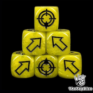 May include: Six yellow dice with black symbols stacked against a black background. The dice have a glittery finish and feature either a target symbol or an arrow pointing upwards. The logo "TheTopDice" is in the bottom right corner.