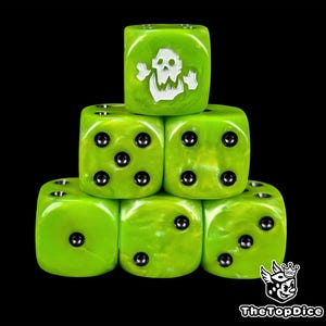 May include: A stack of six green dice with a marbled effect. One die features a white skull and crossbones design. The dice have black pips and are arranged against a black background. The logo "TheTopDice" is in the bottom right corner.