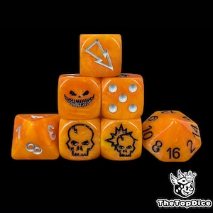 May include: A set of orange and yellow dice with various symbols and numbers. The dice feature a lightning bolt, a jack-o'-lantern face, skulls, and dots. The set includes a 20-sided die. The dice are arranged on a black background.