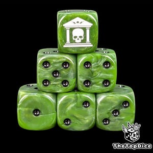 May include: Six green dice with a marbled effect are stacked. One die shows a white graphic of a skull inside a building. The other dice have black dots. The dice are for tabletop games.