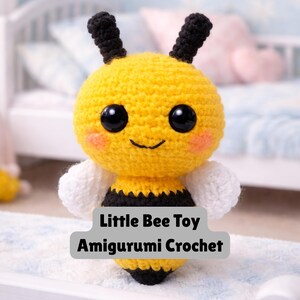 May include: A crocheted bee toy with a yellow body, black stripes, and white wings. The bee has large black eyes, rosy cheeks, and black antennae. The text "Little Bee Toy Amigurumi Crochet" is displayed on the image.