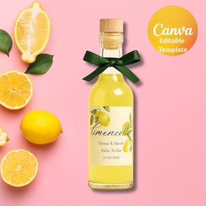 May include: A bottle of limoncello with a wooden cork and a green ribbon, with a label that reads "Limoncello" and the names "Emma & David" and the date "12.06.2026". The bottle is surrounded by lemons on a pink background.