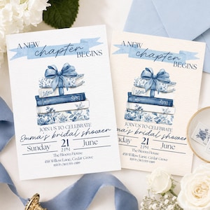 May include: Two bridal shower invitations with a stack of blue books tied with a bow. The text "A New Chapter Begins" is above the books. The invitations include the date, time, and location of the event.