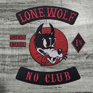 May include: A collection of black and red embroidered patches. The patches include the words "LONE WOLF" and "NO CLUB" in red script. A central patch features a cartoon wolf's head. A diamond-shaped patch displays "1%."