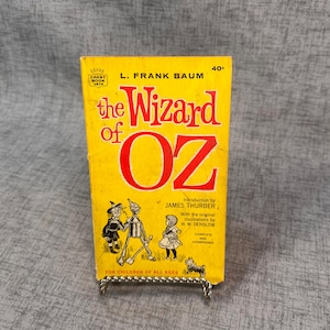 The Wizard of Oz book by L. Frank Baum yellow paperback published 1963