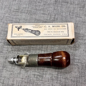 Myers sewing awl with original box, includes one needle, one wrench/screwdriver tool, one needle threader. Good condition. $15