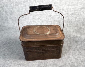 Antique metal lunch pail with wood handle