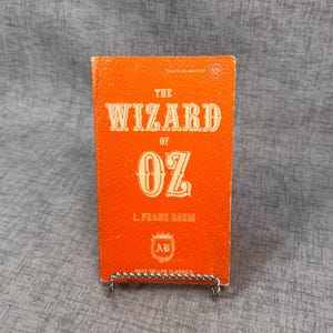 O Mágico de Oz, livro de L. Frank Baum, capa de couro sintético laranja