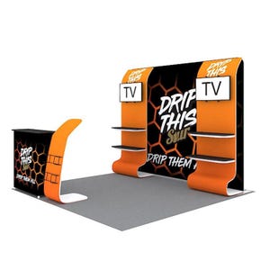 May include: An orange and black trade show booth with the text "DRIP THIS SAUCE" and "DRIP THEM ALL". The booth has two TV screens, shelves, and a counter. The booth is on a gray floor.