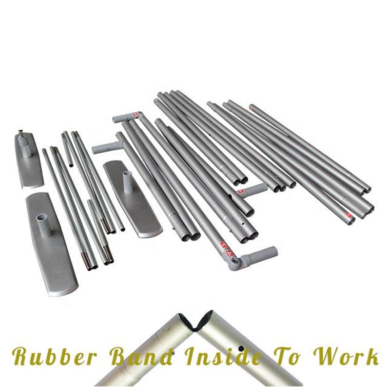 May include: A set of silver telescopic poles for a retractable banner stand. The poles are laid out on a white surface. The poles are made of metal and have a silver finish. The poles are connected by rubber bands.