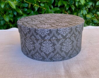 Small dark gray damask paper  band box, paper covered box