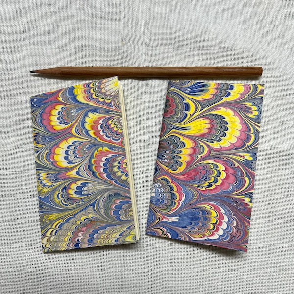 Pair (2) of pink, blue and yellow hand marbled paper hand sewn notebooks