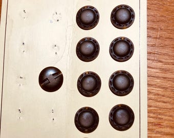 Olive green celluloid buttons.  Set of 13.
