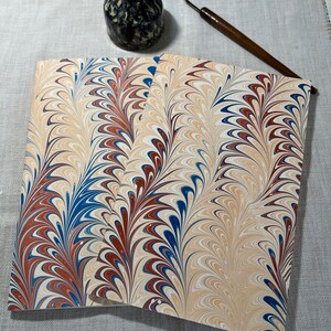 Beige, blue, and red hand marbled paper hand sewn notebook image 1