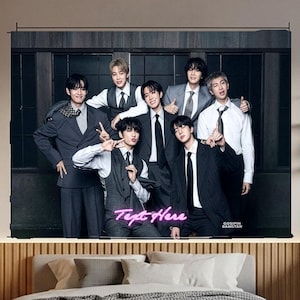 May include: A rectangular wall tapestry featuring a group of seven individuals dressed in formal suits and ties, posing against a dark panelled background. The image includes the neon pink text "Text Here" and the small white text "GOSIPIN BANGTAN".