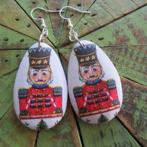 Nutcracker Earrings on Wood with Silver Ear Wires on White Background Star Hats