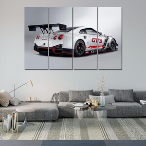 May include: A four-panel wall art set featuring a white sports car with red and black accents. The car has a large rear wing and the text "GT3" on the side. The artwork is displayed in a modern living room setting.